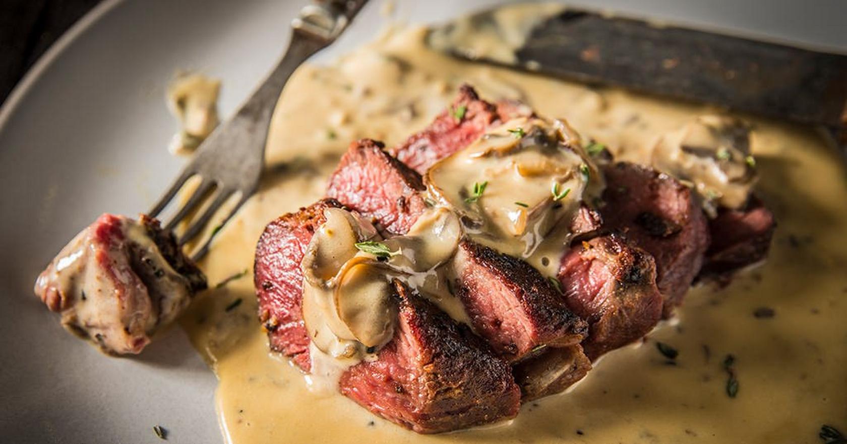 Grilled Peppercorn Steaks with Mushroom Cream Sauce