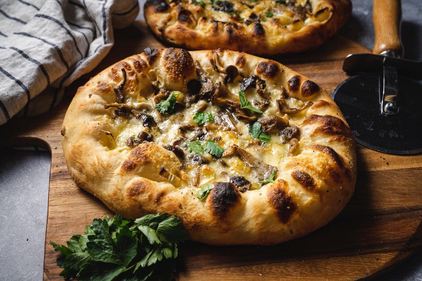 Cheesy Confit Garlic and Mushroom Pizza | Traeger Grills