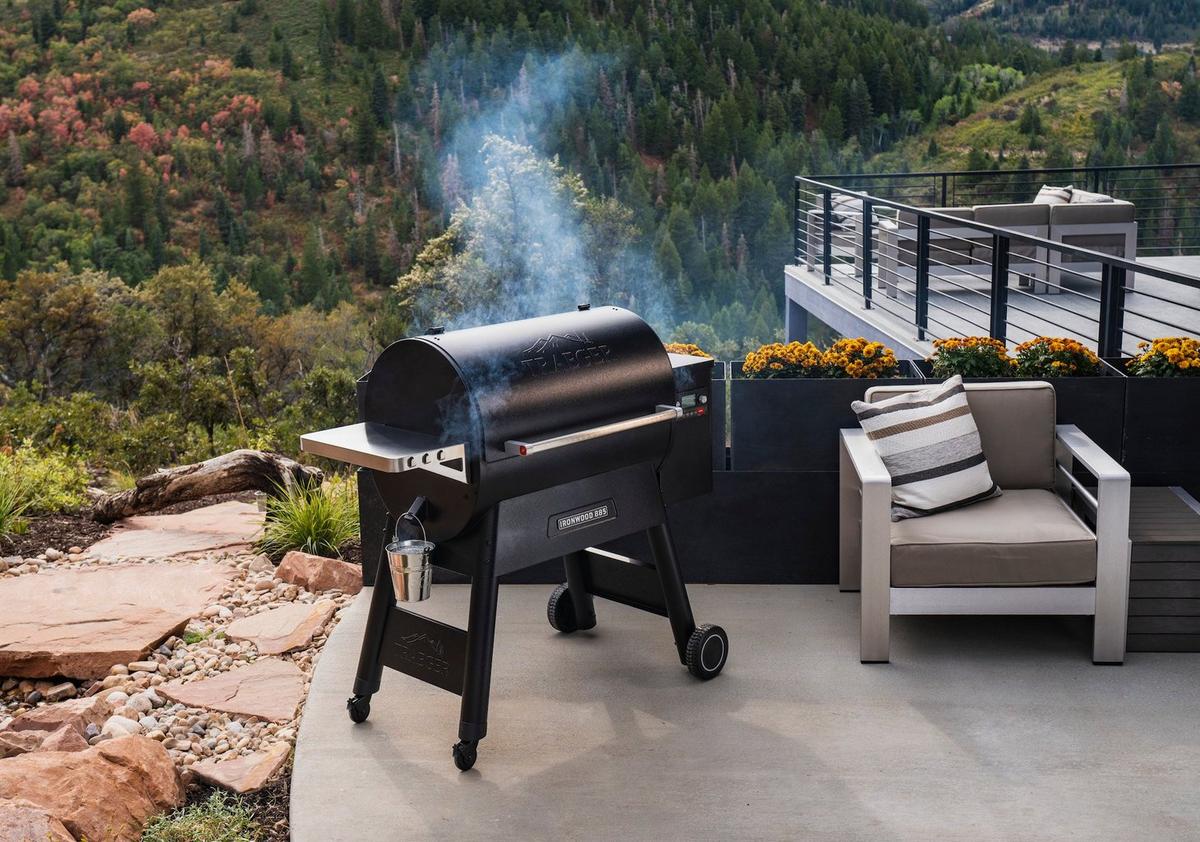 https://i8.amplience.net/i/traeger/Ironwood%20885_Lifestyle_Grill_only?scaleFit=poi%26%24poi2%24&fmt=auto&w=1200&qlt=default