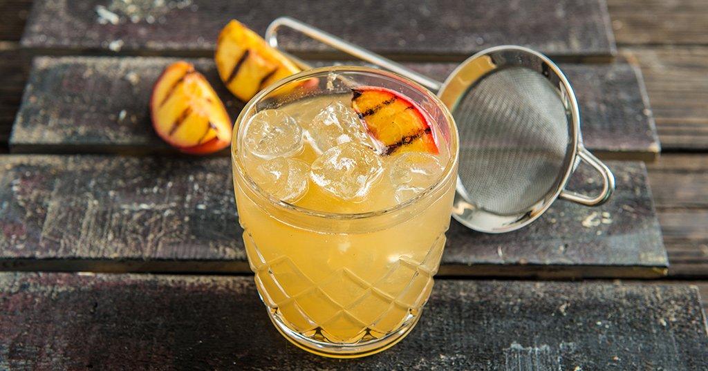 Grilled Peach Sour Cocktail Recipe | Traeger Grills