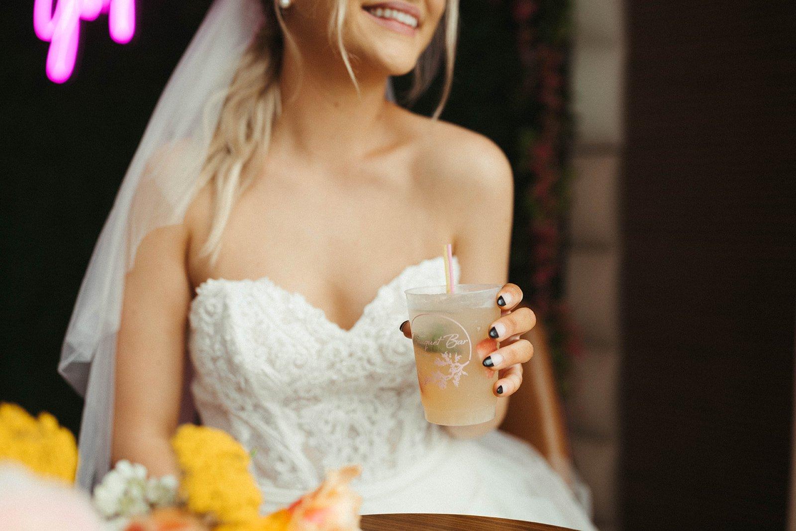 Bride Sipping Cocktail