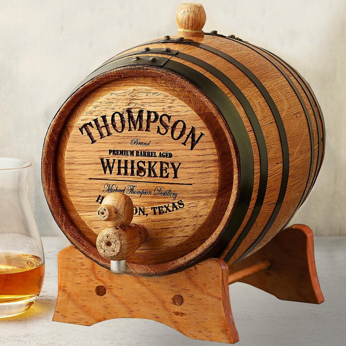 a personalized little whiskey cask hand-made from American white oak, reinforced with steel hoops comes with a wooden stand, care instructions, and storing/sterilization tablet