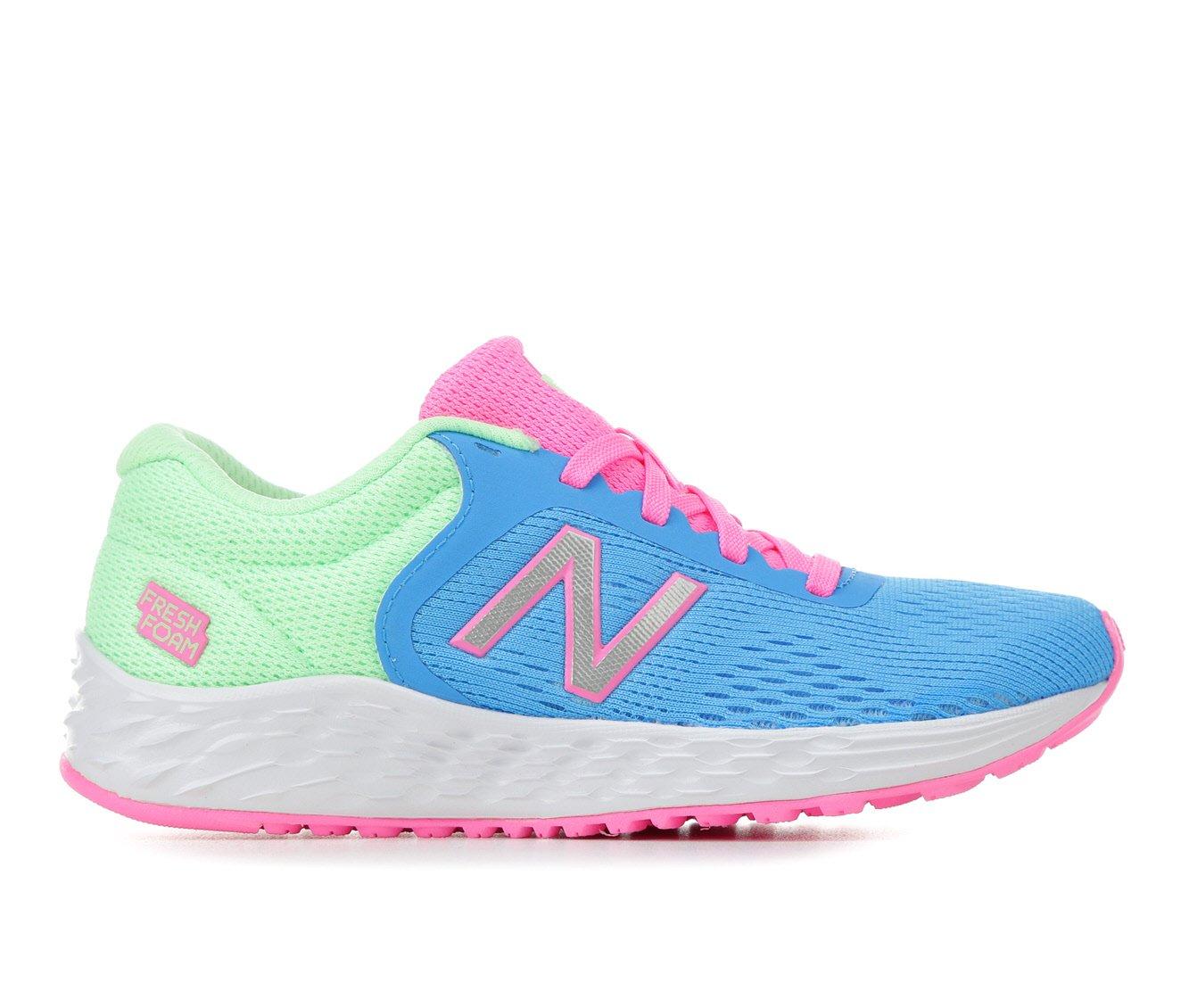 Little girls shop athletic shoes